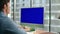 Unknown businessman chroma key virtual call office closeup. Blue screen device