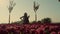 Unknown girl playing cello in amazing tulip field in bloom. Blooming garden