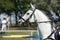 Unknown jumping rider on horseback overcomes barriers