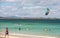 Unknown kitesurfer surfing on a flat azure water of Atlantic ocean in Corralejo