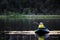 An unknown man on a float tube bringing in a trout