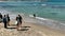 Unknown men and women on the dog beach , favorite vacation place for local people. Tel Aviv, Israel