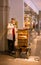 An unknown musician plays the barrel organ in the center of Bern