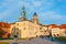 Unknown people visit the Wawel Castle in Krakow. Krakow is one of the most famous landmark in