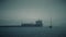 Unknown sailboat and cargo ship at sea near Gibraltar