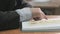 Unknown schoolboy dressed in suit reads book