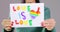 Unknown woman shows LGBT flag rainbow symbol