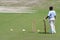 Unknown young cricket player in a training session.