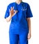 Unknown young female doctor in blue medical uniform showing ok s