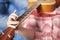 Unknown young man playing guitar at home