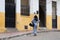 Unknown young woman walking on the street in the historical part of Tangier