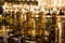 Unlabeled glass bottles in bottling machine at modern winery