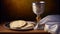 Unleavened bread, chalice of wine, silver kiddush wine cup on red background. Communion still life. Christian