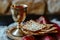 Unleavened bread with silver chalice of wine. Christian communion concept for reminder of Jesus sacrifice. Generative AI.