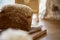 Unleavened sourdough natural sesame bread on wooden cutting board. Loaf of bread. Beige food background