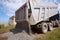 Unloading ballast on the road on a sunny day.