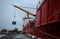 Unloading a cargo ship near the pier