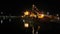 Unloading Cargo from a Ship in the Sea Port of Batumi by Night. Time Lapse