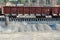 Unloading of crushed stone a railway car of a dump truck, closeup