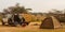 Unloading parked jeep at camp on safari