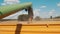 Unloading Pipe Of Harvester Pouring Grains Into A Tractor-Trailer - Transportation And Selling