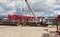 Unloading sections of the boom of a large crawler crane using a