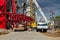 Unloading sections of the boom of a large crawler crane using a