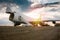 Unloading wide body transport cargo plane in the morning sun