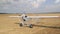 Unmanned aerial vehicle. UAV delivery drone cargo. The plane leaves the field for takeoff. The compact device on