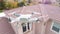 Unmanned Aircraft System UAV Quadcopter Drone In The Air Over House Inspecting the Roof