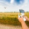 Unmanned copter. Man controls quadrocopter flight.