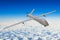 Unmanned military aircraft background blue sky clouds.