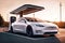 Unmanned white electric car charges at a fast charging station