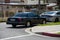 Unmarked police cars parked at the scene as LAPD Valley Homicide Detectives serve a warrant