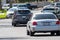 Unmarked police cars parked at the scene as LAPD Valley Homicide Detectives serve a warrant