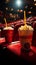 Unoccupied red seats, popcorn, and drinks strewn across the theater floor