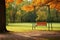 an unoccupied swing swaying gently in an empty park