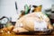 Unpacked from its plastic packaging fresh Capon Chapon cockerel meat on kitchen wooden top Price tag of 36,62 Euros on