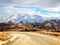 Unpaved mountain road in the Central Otago region of the South Island of New Zealand in the winter afternoon