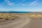An unpaved road in the desert landscape in El Calafate city, the Lake Argentino and the Lagoon Nimez, Patagonia Argentina.