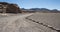 Unpaved road near Ancient Petroglyphs on the Rocks at Yerbas Buenas in Atacama Desert in Chile