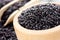 Unpolished black rice in a wooden bowl