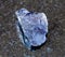 unpolished Cordierite (Iolite) crystal on black