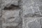 Unpolished grey stone wall, background with grunge texture