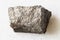 unpolished Pyrrhotite (Pyrotite) rock on white marble