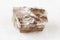 unpolished Smoky Quartz rock on white marble