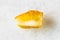 Unpolished yellow Amber gemstone on white marble