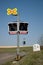 Unprotected railway crossing. Railway signaling equipment at a train crossing, Czech Republic. Railway infrastructure. Sunny