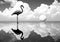 Unreal and gloomy landscape with clouds and a flamingo, in the water. Minimalist style. AI generated