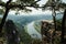 Unreal landscape on the river Elbe from above through rocks and trees in Saxon Switzerland. View from the viewpoint of Bastei in